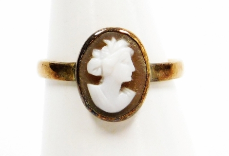 A 9ct gold cameo dress ring, oval cameo depicting bust portrait of a classical lady, in rub over setting, ring size M, 1.9g all in.