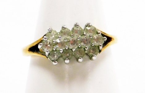 A cluster ring, set with layered cz stones, on yellow metal band, unmarked, ring size P½, 2.8g all in.