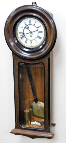 An early 20thC mahogany drop dial wall clock, with an enamel Roman numeric face and shaped hands, thirty hour movement, 79cm high.