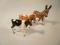 Two Beswick calves and a small Beswick donkey foal