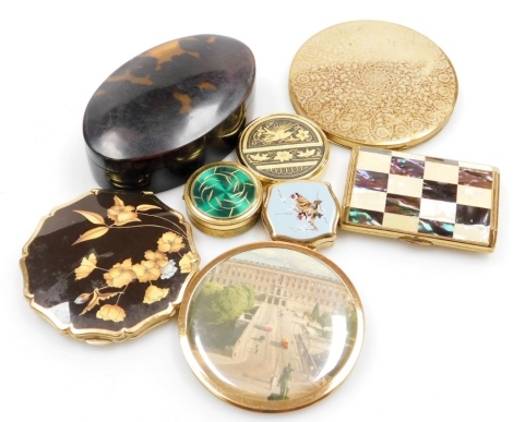 A group of mid 20thC powder compacts, pill boxes, etc., to include a Stratton compact, the lid decorated with yellow and blue flowers against a brown ground, 18.5cm wide, a Vogue Ganites compact, the lid with etched decoration of flowers and leaves, a sim