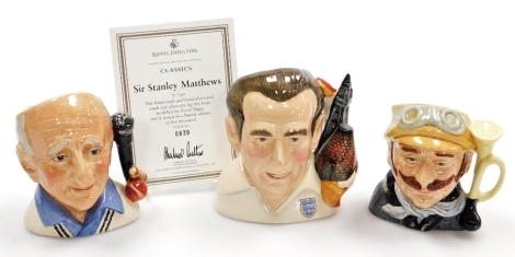 Three Royal Doulton character jugs, comprising Sir Stanley Matthews D7161, limited edition number 839, with certificate, Johnners D7018 limited edition number 2456, and Veteran Motorist D6637, 12.5cm, 11.5cm, and 10.5cm high respectively.