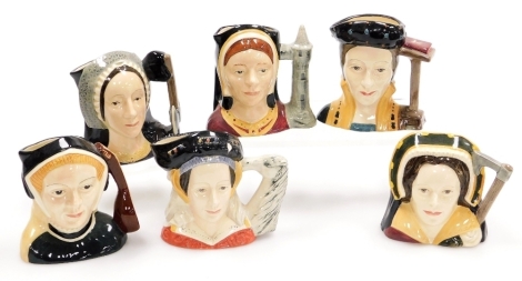 Six Royal Doulton character jugs, comprising wives of Henry VIII; Catherine of Aragon D6658, Catherine Parr D6651, Jane Seymour D6746, Anne of Cleaves D6753 (AF), Anne Boleyn, D6650, and Catherine Howard D6692, ranging from 10cm to 10.8cm high.