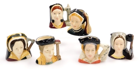 Six Royal Doulton character jugs, comprising wives of Henry VIII, Catherine Howard D6693, Catherine Parr D6752, Catherine of Aragon D6658, Jane Seymour D6747, Anne Boleyn D6651, and Anne of Cleaves D6754, all approx 6.5cm high.