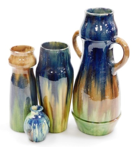 Three continental Art Nouveau pottery vases, each with blue green and brown mottle glazes, possibly Austrian, the largest 37cm high, and another.