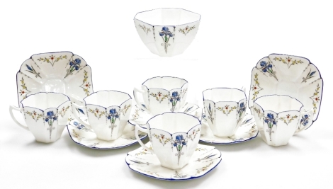 A Shelley porcelain Blue Iris pattern part coffee service, Queen Anne shape, no F11561, printed and painted marks, comprising sugar bowl, six cups and saucers.