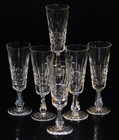 A set of six Waterford Kylemore pattern cut glass champagne flutes, each of tapering form, raised on a hexagonal stem.