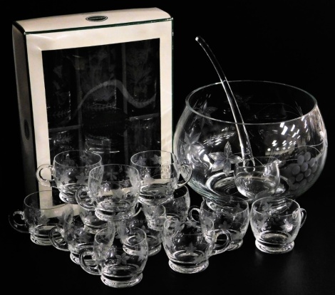 A cut glass punch set, comprising punch bowl, ladle, and twelve cups, decorated with leaves and grapes, etc, and a set of six Portmeirion glasses, boxed.