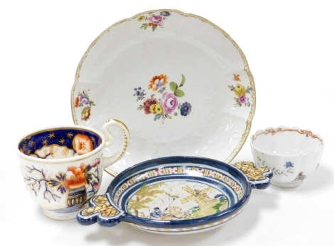 A 19thC Meissen porcelain saucer, decorated with coloured flower sprays, against a bianco sopra bianco ground, blue cross sword mark to underside, 17.5cm diameter, a Spanish Teoledo pottery two handled cup, decorated with a knight on horseback and a windm