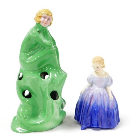 A 1920/30's Wilkinson pottery centrepiece modelled in the form of a scantily clad seated lady, in green, and a Royal Doulton figure of Marie HN1370. (2)