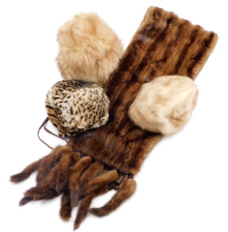 A group of three fur hats and a stole.