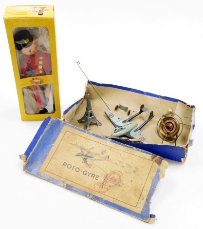 A French S.G.D.G tin plate roto-gyre, with Eiffel Tower base, in original box (AF), and a Pelham puppet, boxed. (2)