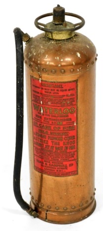 A vintage Waterloo copper fire extinguisher made by Reid and Campbell Limited, London, 56cm high.