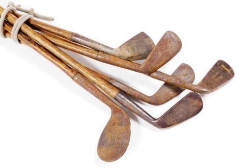 Six 20thC hickory shafted golfing irons, comprising; Roper, Murton, Strate, Laird, Wingate and unidentified.