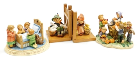 A Hummel 2016 first issue figure group A Bedtime Prayer, a similar titled Happy Harvest and a pair of Hummel bookends, Chick Girl and Boy with Rabbits. (4)