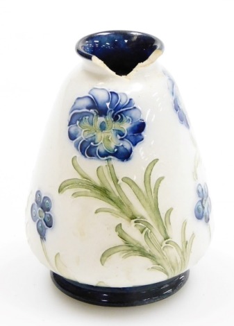 A Moorcroft Macintyre Florian pattern pottery vase, of tapering form, with incised decoration of Poppies against a white ground, printed and painted marks, 7.5cm high. (AF)