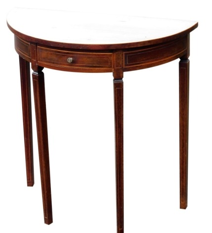 A mahogany and boxwood strung demi lune side table, with a frieze drawer, on square tapering legs, 38cm high, 65cm wide, 32cm deep.