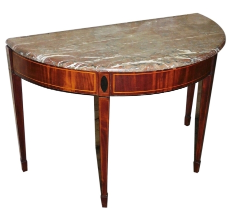 A 19thC mahogany and boxwood strung demi lune side table, the top with a variegated marble top above a plain frieze, on square tapering legs with spade feet, 71cm high, 107cm wide, 54cm deep.