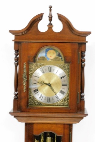 An Emperor Clock Company grandmother clock, the arched brass dial with moon phase, silvered chapter ring bearing Roman numerals, in a mahogany case, with panelled base, 191cm high overall, sold with a further clock movement.