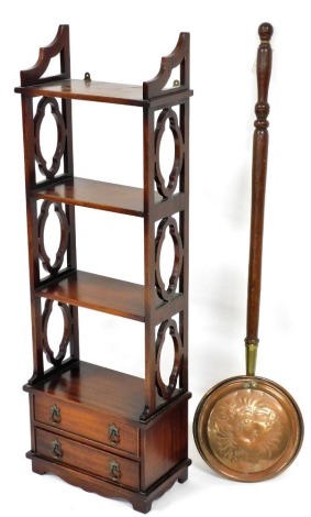 A Georgian style mahogany wall shelf, with pierced sides and two drawers, 108cm high, 36cm wide, and an engraved brass warming pan with turned wood handle. (2)
