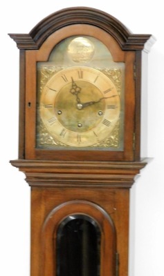 A grandmother clock, the arched brass dial signed Tempus Fugit, silvered chapter ring bearing Roman numerals, Westminster eight day movement with rod strike, the mahogany case with a panel base and bracket feet, 178cm high.