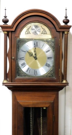 A longcase clock, the brass dial with silvered chapter ring bearing Roman numerals, stamped Tempus Fugit in a mahogany case, with quarter veneered base, 193cm high.