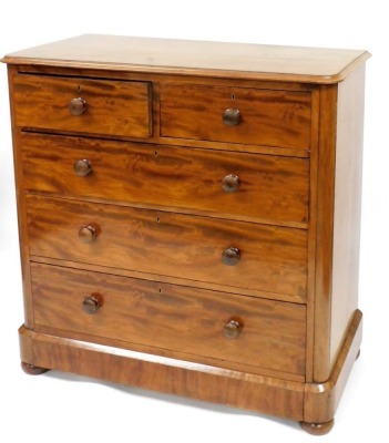 A Victorian mahogany chest of drawers, the top with a moulded edge above two short and three long figured drawers, on bun feet (AF), 114cm high, 113cm wide, 57cm deep.