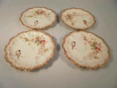 Four late 19thC Limoges porcelain plates transfer printed with flowers