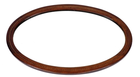 An Edwardian oval mahogany and chequer banded wall mirror, 66cm x 41cm.