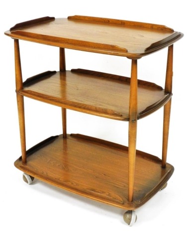 An Ercol elm three tier trolley, with a galleried edge, on castors, 78cm high, 70cm wide, 45cm deep.