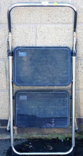 A metal framed two step ladder.