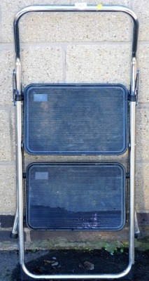 A metal framed two step ladder.