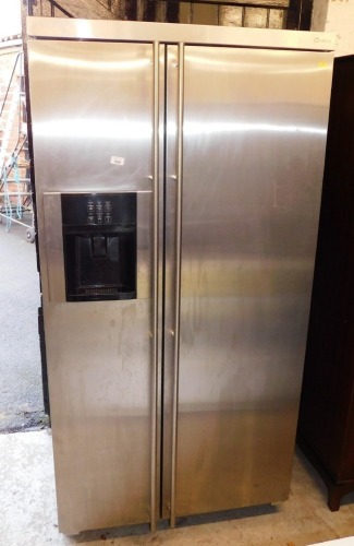 A Maytag American style fridge freezer, with ice dispenser.