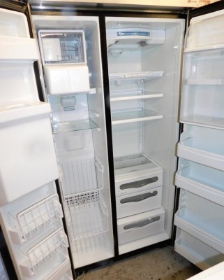 A Maytag American style fridge freezer, with ice dispenser. - 2