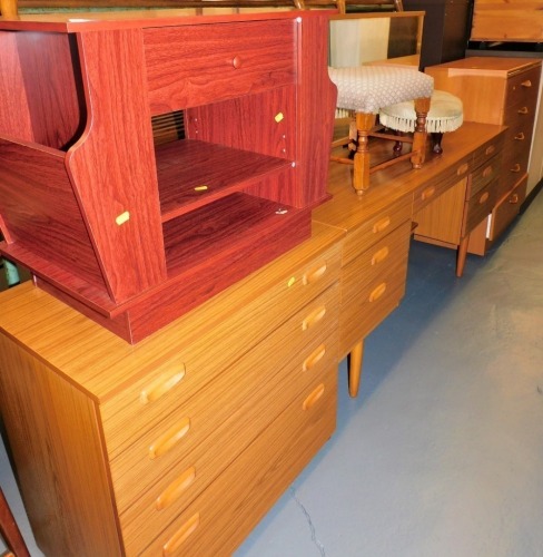 A group of bedroom furniture, comprising five drawer chest, 98cm high, mirror back dressing table, 152cm wide, and a further four drawer chest, 73cm high, footstool, etc. (a quantity) The upholstery in this lot does not comply with the 1988 (Fire & Fire F