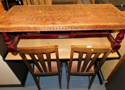 An office desk, 121cm wide, two oak dining chairs with drop in seats, and a Peruvian rectangular coffee table, with a decorated leather top, the top 120cm x 50cm.