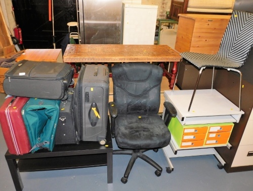 A quantity of suitcases, a two tier coffee table, the top, 56cm x 92cm, office chair, etc. (a quantity)