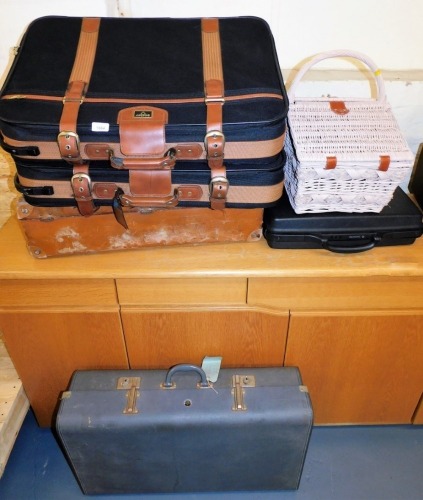 Suitcases, including Antler, a pink wicker picnic hamper, etc. (a quantity)