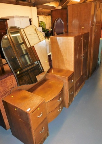 A mid 20thC oak bedroom suite, comprising single wardrobe, compactum, and a glazed back dressing table.