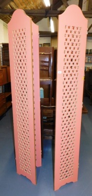 A pair of three fold screens, with pierced star decoration to each panel, 196cm high.