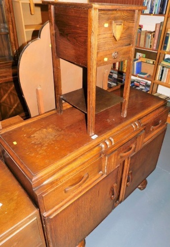 A mid 20thC oak sideboard, with three drawers over two doors, 93cm high, 120cm wide, 49cm deep, and an oak sewing box, 59cm high.