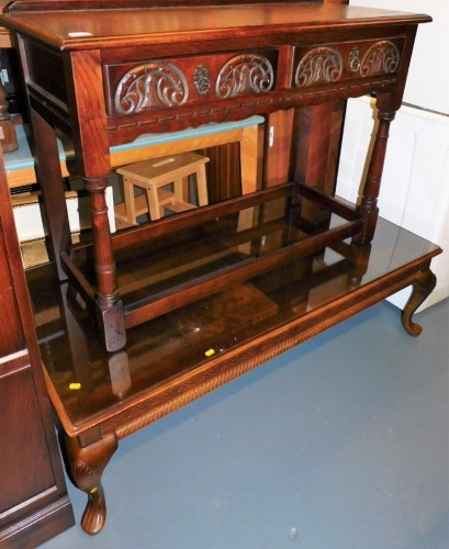 An oak Old Charm side table, with two frieze drawers, 76cm high, 107cm wide, 43cm deep, and a coffee table, the top 66cm x 135cm.