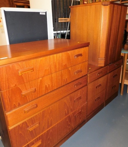 A Furniture by Macintosh chest of drawers, 100cm high, 84cm wide, 47cm deep, two similar bedside chests, and a laundry bin.