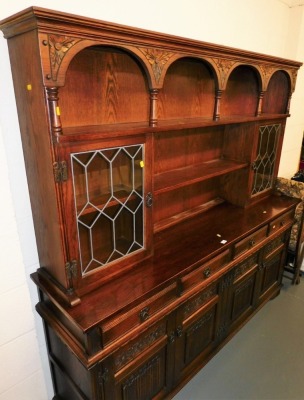 An oak Old Charm dresser, 182cm high, 188cm wide, 44cm deep.