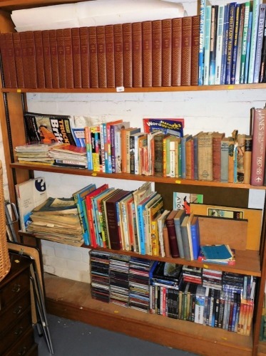 Various books, fiction, non fiction, to include various volumes of the Encyclopedia Britannica, Mrs Beatons Everyday Cooker, Ordnance Survey Maps, Jane's All The Worlds Aircraft 1987-88, The Navy In Action, various CDs, DVDs, etc. (4 shelves)