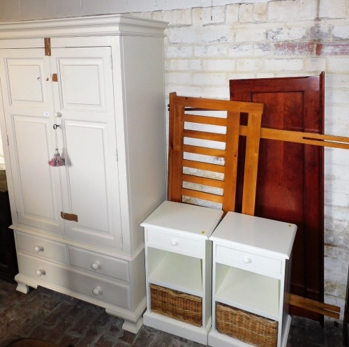 A white painted double wardrobe, with two short and one long drawer to base, 192cm high, 100cm wide, 58cm deep, a pair of similar bedside chests, two headboards, etc. (a quantity)