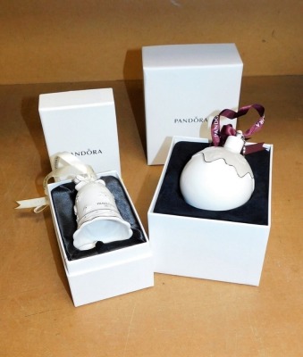 A Pandora porcelain commemorative 2017 Christmas tree decoration, in the shape of a bell, boxed, and a Pandora porcelain 2018 bauble, boxed.