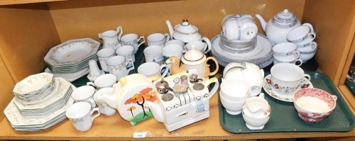 A Johnson Brothers part tea, dinner and coffee service, a Past Times Clarice Cliff style teapot, 17cm high, Royal Worcester part tea wares, a Masons Vista pattern teacup, etc. (1 shelf)