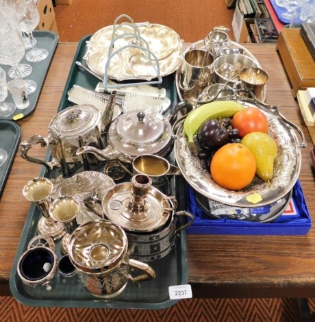 Various plated wares, to include a three piece tea service, chamber stick, four sectional bowl, part dressing table set, a Queens Silver Jubilee commemorative wall plaque, treen carved fruit, goblet, etc. (2 trays and loose)
