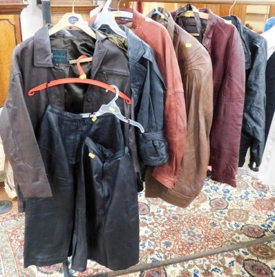 A quantity of leather jackets, in various colours, two leather pencil skirts, and a brown leather handbag with horsebit decoration.